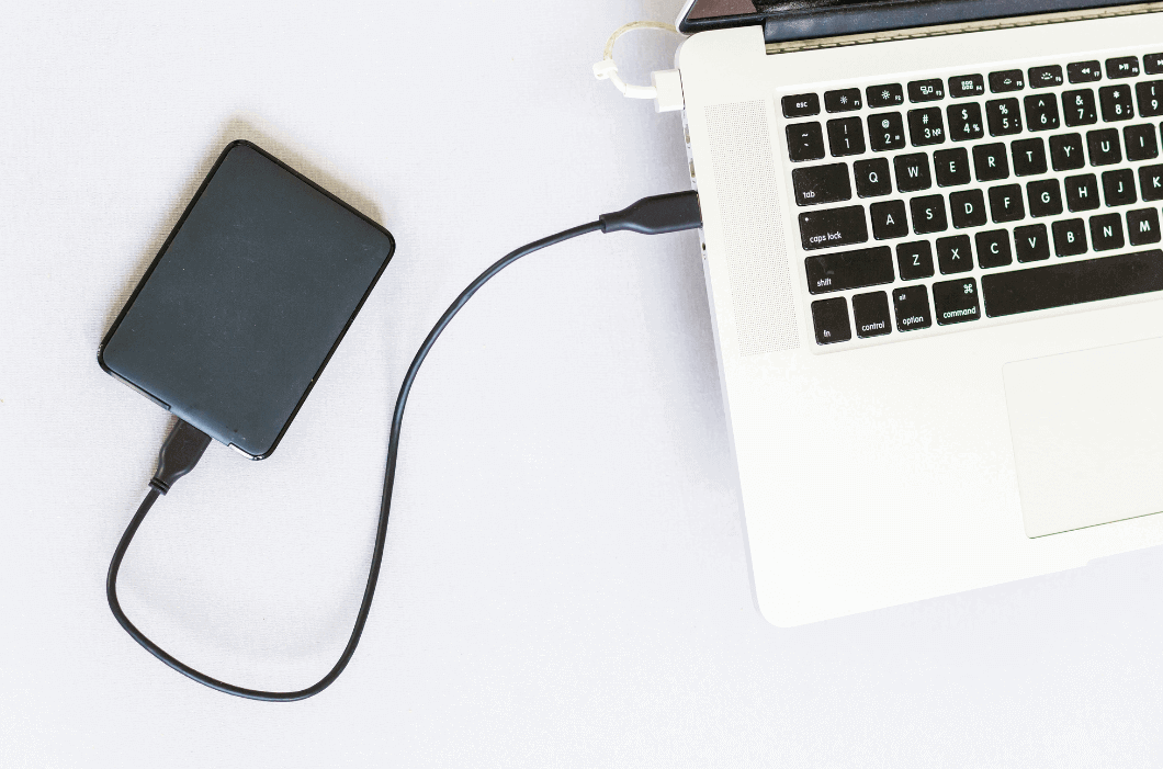 External backup disk hard drive connected to laptop